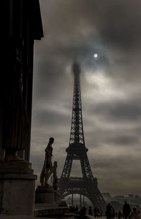 Low angle view of building against cloudy sky