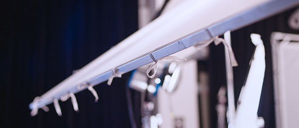 Close-up of clothes hanging on rack