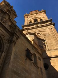 Low angle view of ornate building against sky