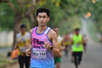 Portrait of a young man running outdoors