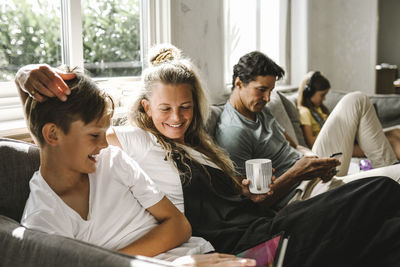 Group of people sitting on sofa