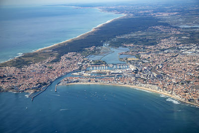 High angle view of city by sea