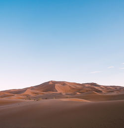 Scenic view of desert against clear sky