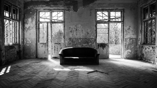 Empty chair in abandoned building