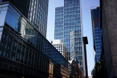 Low angle view of modern buildings against clear sky