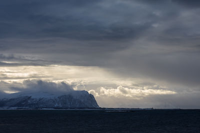Scenic view of norwegian sea against cloudy sky