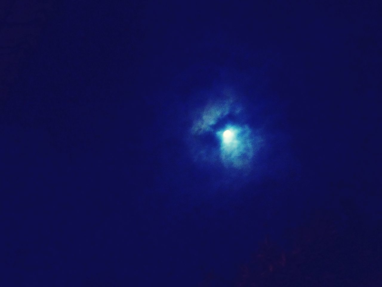 LOW ANGLE VIEW OF MOON IN SKY AT NIGHT