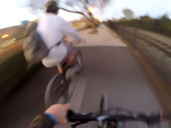 Man cycling on road