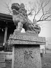 Low angle view of statue against sky