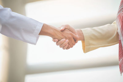 Cropped image of people shaking hands