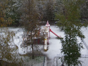 Gazebo by trees during winter