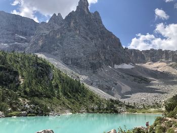 Scenic view of lake and mountains against sky