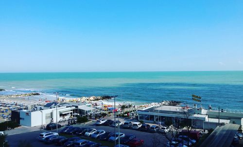 High angle view of sea against clear blue sky