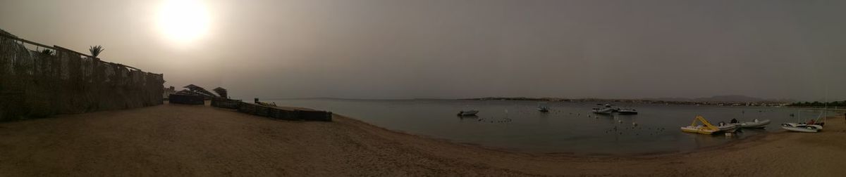 Panoramic view of beach against sky during sunset