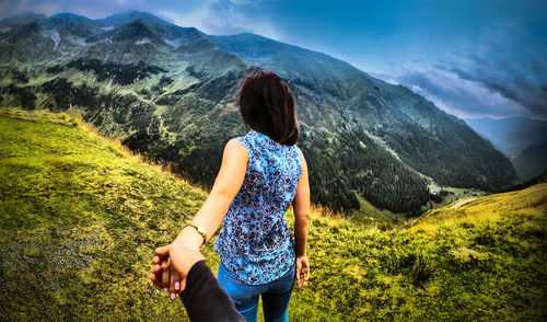 Rear view of woman looking at mountains