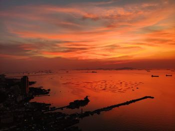 Scenic view of sea against romantic sky at sunset