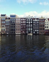 Buildings in city against sky