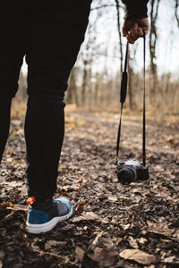 Low section of person on swing at playground