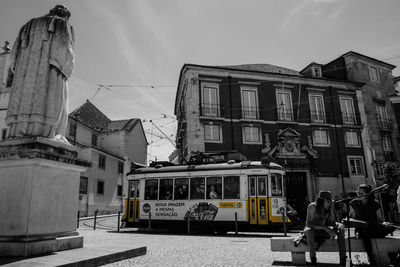 Cars on city against sky