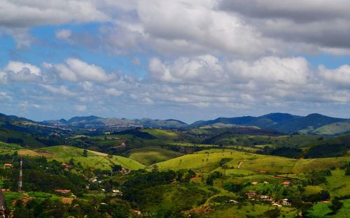 Scenic view of agricultural landscape against sky