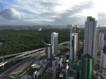 High angle view of buildings in city against sky