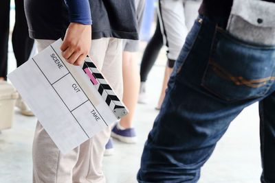 Close-up of person holding film slate