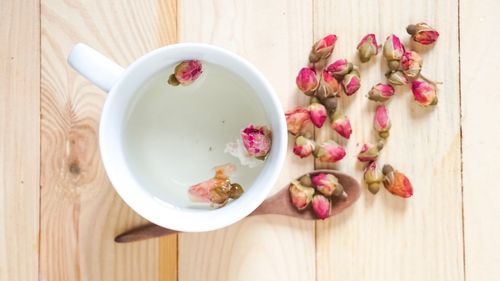 Directly above shot of pink flowers in bowl on table