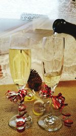 Close-up of wine glasses on table