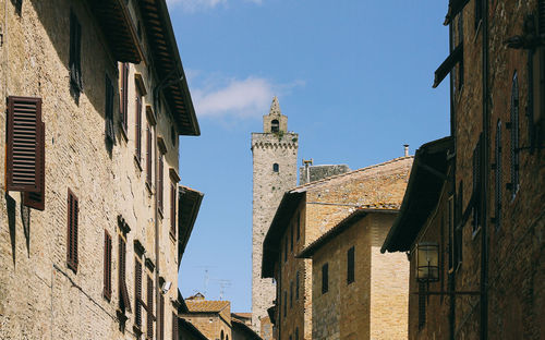 Low angle view of bell tower against sky