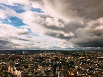 High angle view of cityscape against cloudy sky