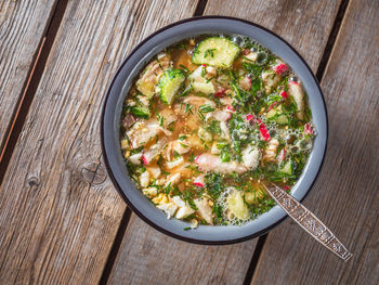 High angle view of okroshka in a bowl on a table