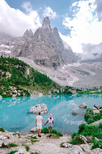 Scenic view of lake and mountains against sky