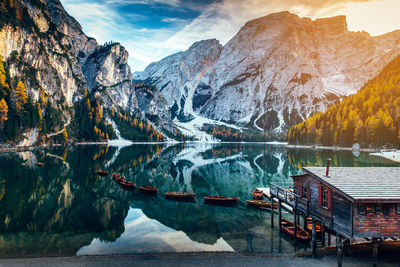 Scenic view of lake by snowcapped mountains