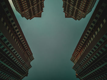 Low angle view of buildings against sky at night