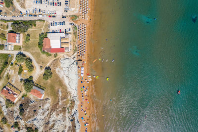 High angle view of crowd on road by sea