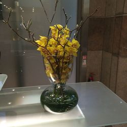 Close-up of yellow flower vase at home