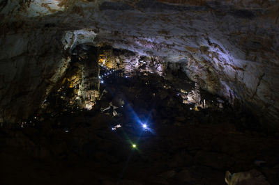 Low angle view of illuminated cave