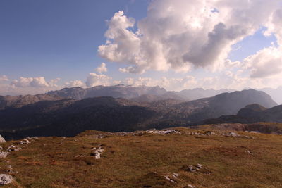 Scenic view of landscape and mountains against sky