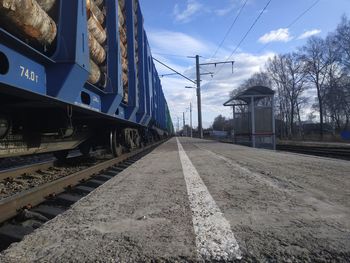 Train at railroad station against sky