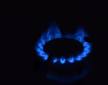 Close-up of illuminated light painting against black background