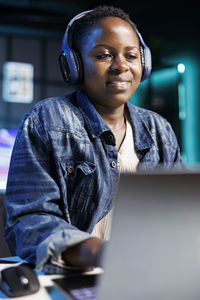 Portrait of young man using digital tablet