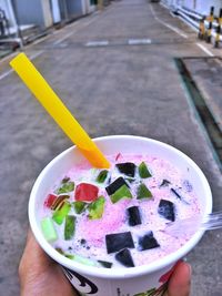 Close-up of hand holding ice cream