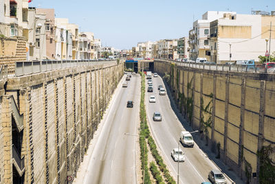 High angle view of street amidst buildings in city