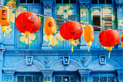 Illuminated lanterns hanging in city, singapore