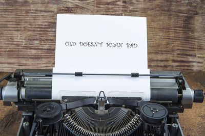 High angle view of text on table against wall