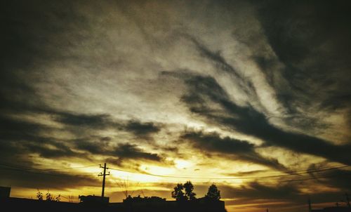 Low angle view of cloudy sky at sunset