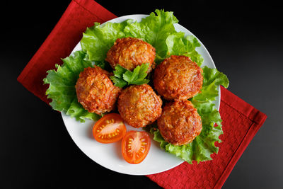 Meat balls in tomato sauce on a black background. homemade protein meal for healthy eating.
