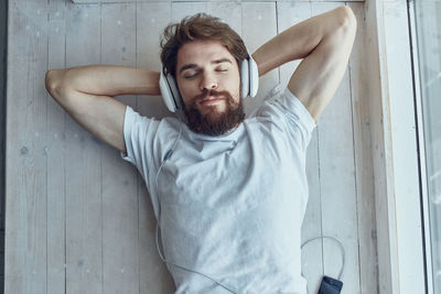 Portrait of young man sitting at home