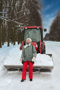 Full length of boy on snow covered land