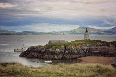 Scenic view of mountain against cloudy sky